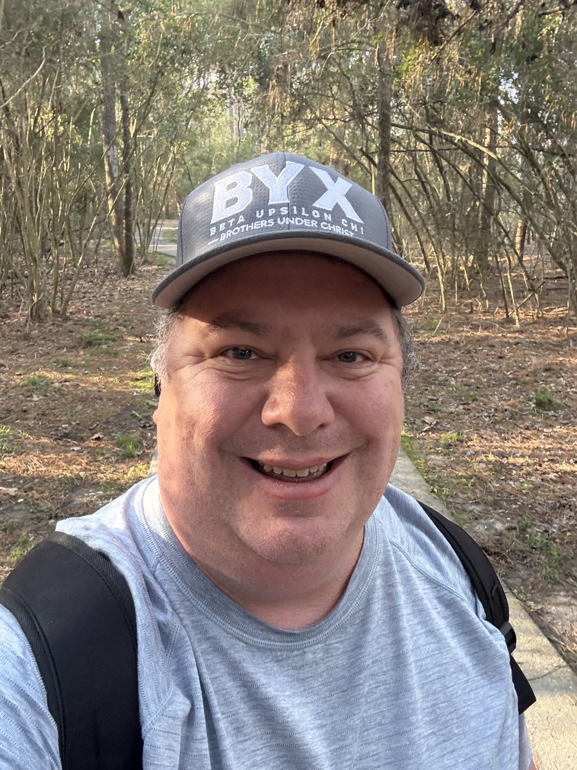 Team Leader Jeremy Williams Red Hawk Property Team JLA Realty wearing a BYX Brothers Under Christ Hat Founding Father at Texas State University